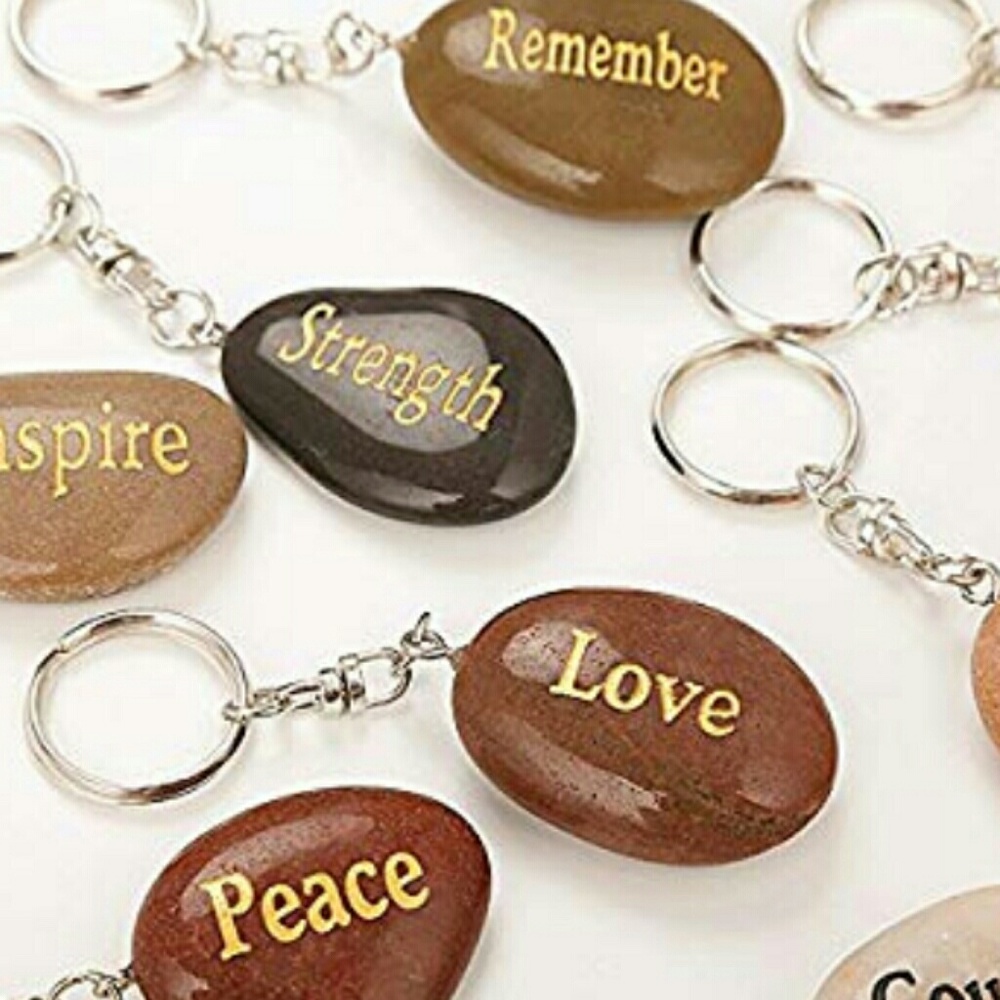 Rocks of encouragement key chains. 12 sayings